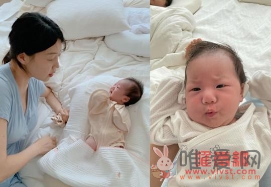 韩智惠分享育儿状况 韩智惠用婴儿背袋抱着女儿